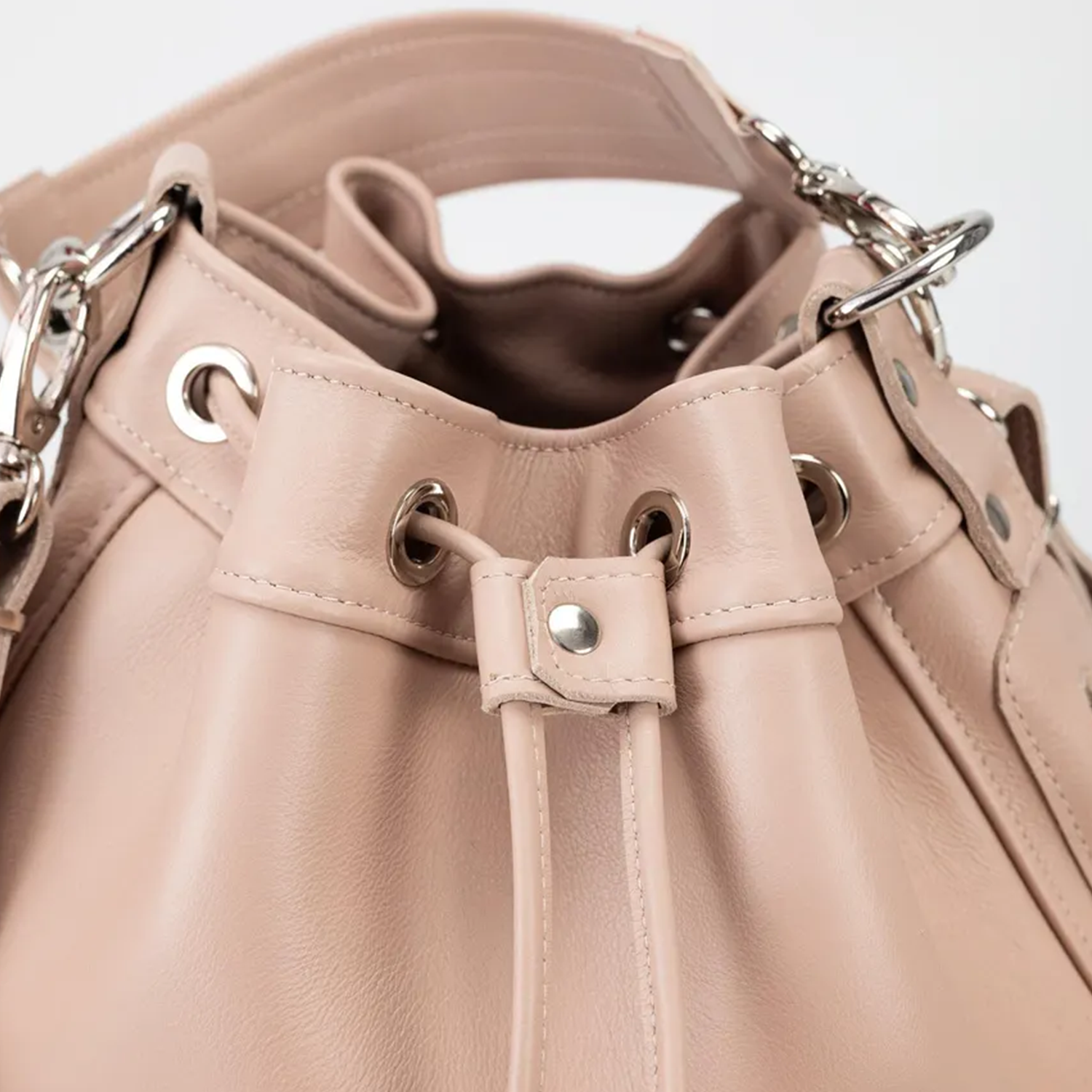 Blush Neutral Soft Cinch Bucket Purse With Detachable Carry Loops, Dual Outer Zip Compartments And Structured Flat Base Silhouette Drawstring Bag