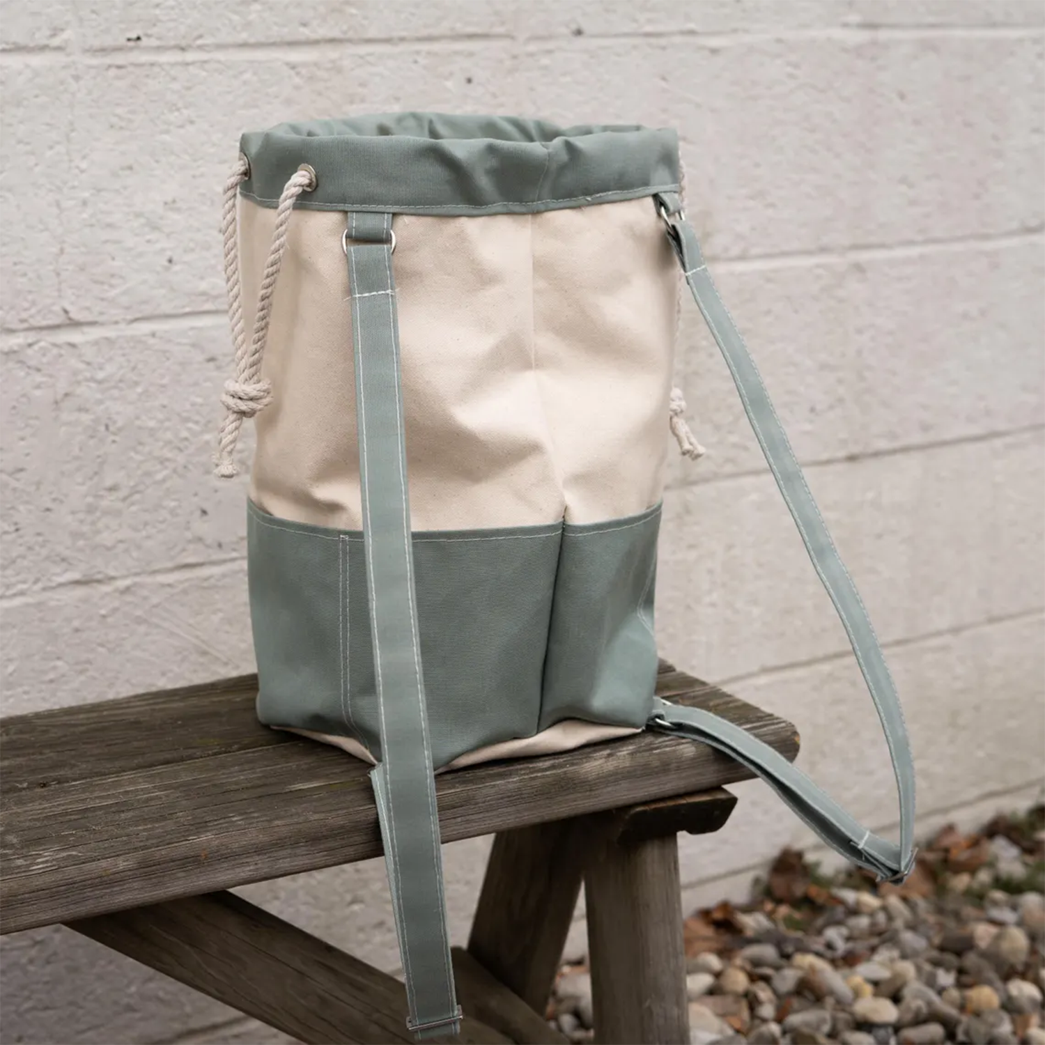 Two-Tone Split Panel Canvas Bucket Backpack With Rolled Cord Drawstring Top, Front Divided Patch Pocket And Solid Color Accent Sections