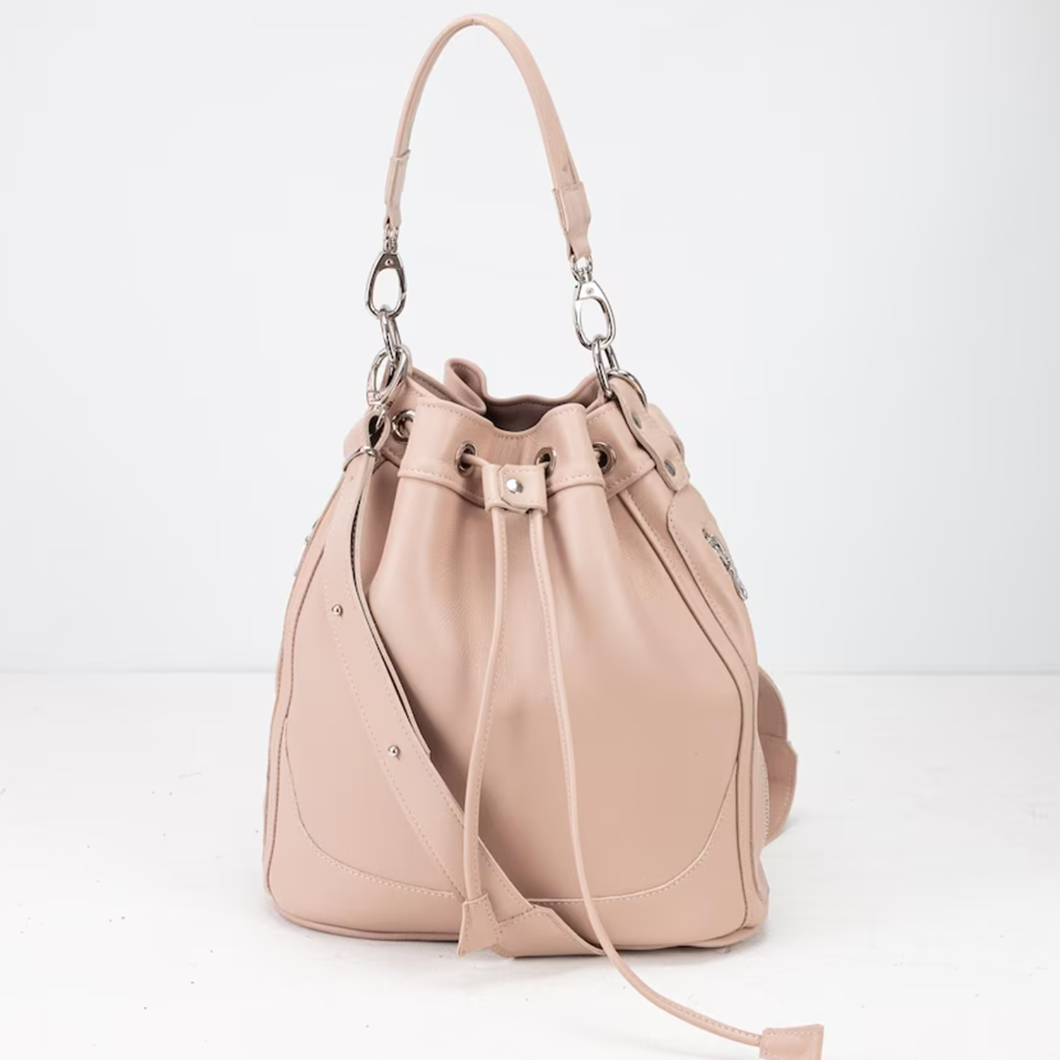 Blush Neutral Soft Cinch Bucket Purse With Detachable Carry Loops, Dual Outer Zip Compartments And Structured Flat Base Silhouette Drawstring Bag