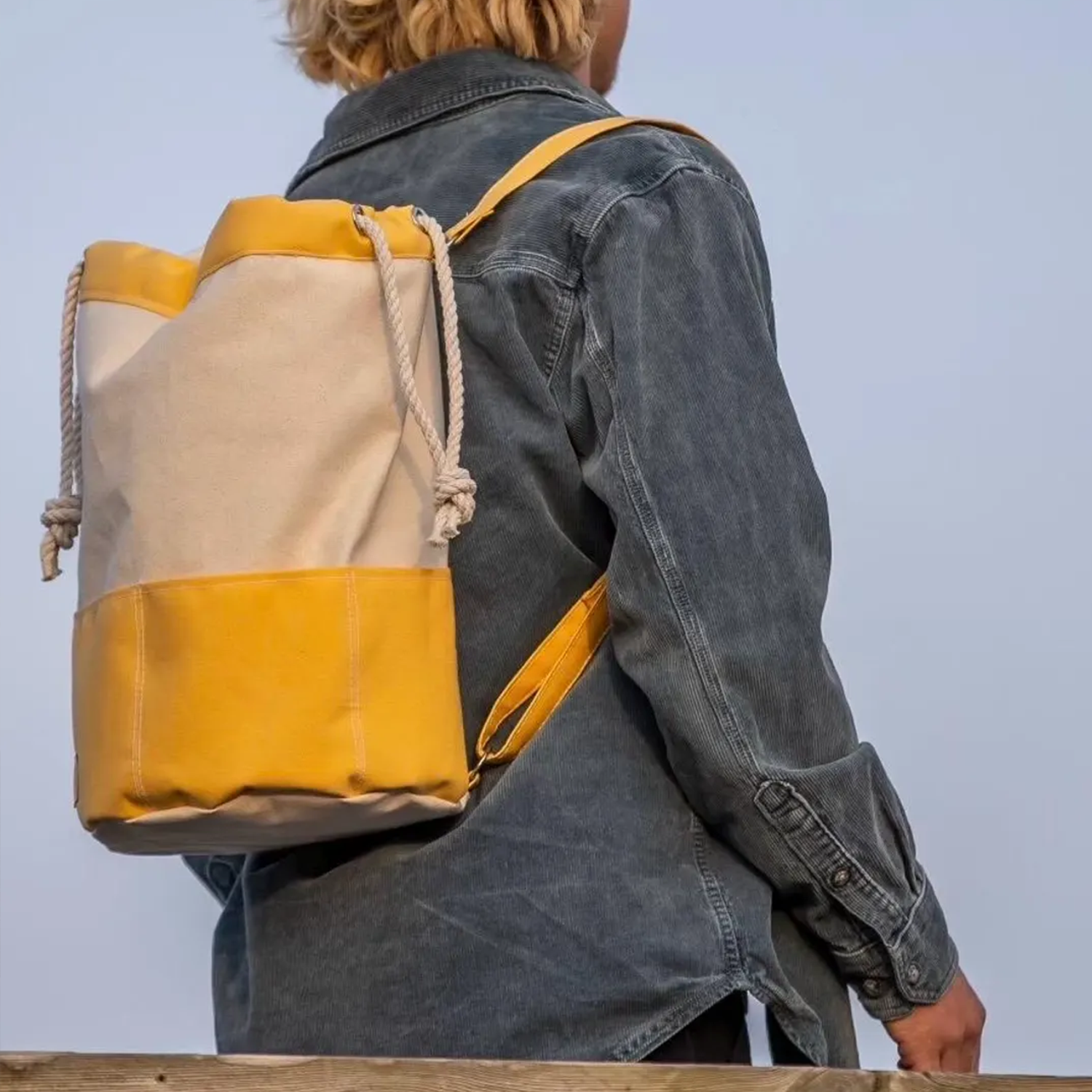 Two-Tone Split Panel Canvas Bucket Backpack With Rolled Cord Drawstring Top, Front Divided Patch Pocket And Solid Color Accent Sections